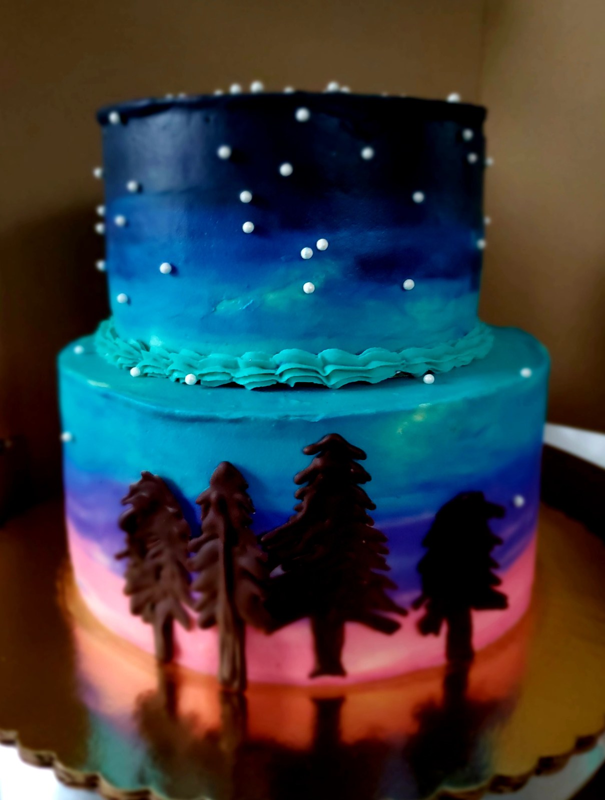 Pastel de galaxia con pinos